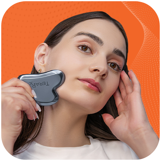 Woman using TeraRX Terahertz Gua Sha facial tool for skincare massage and facial sculpting